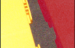 Close up of a red plastic gym scooter about to be connected to a yellow plastic gym scooter using a patented tongue and groove built-in connecting feature.