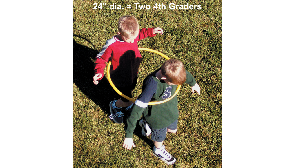 two young boys inside a twenty four inch diameter hula hoop with text stating they are fourth graders