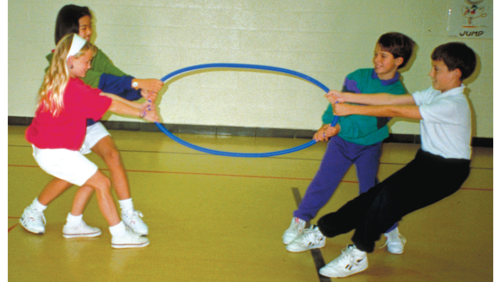 Four kids tugging on a no-kink hoop, showing the hoop does not kink