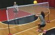 Two young teen girls playing volleyball over a multi-dome dual net